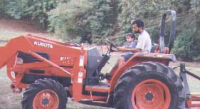 Daddy driving tractor